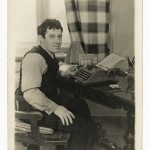 Семен Кирсанов в рабочем кабинете за рабочим столом с пишущей машинкой, 1930-е