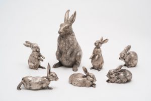 Набор из кувшина в виде фигурок зайца и шести зайчат. 1894